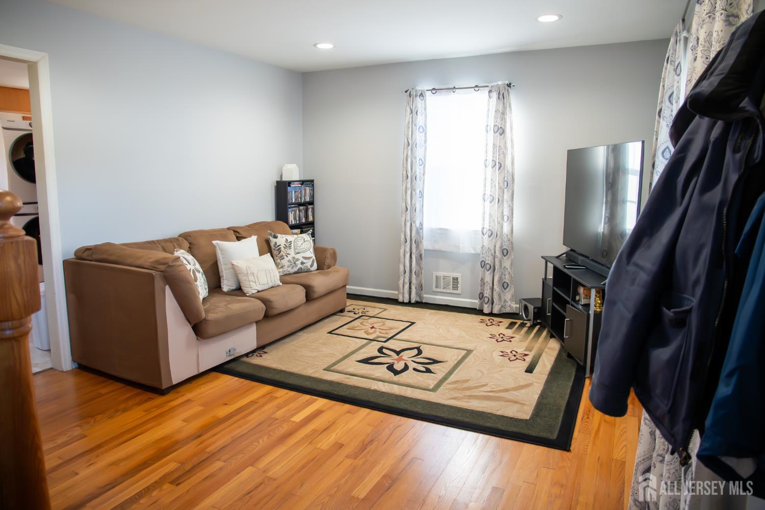 13 Eberly Place Fords, NJ 08863 - Photo 2 of 12 a living room with furniture and a flat screen tv