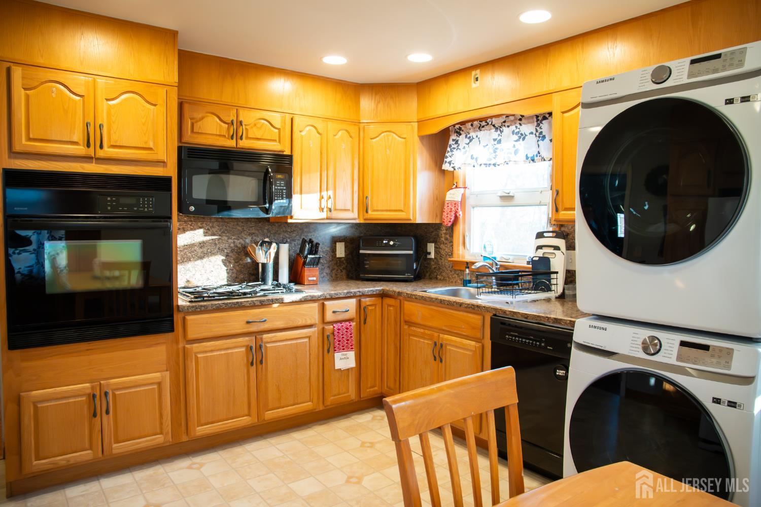 13 Eberly Place Fords, NJ 08863 - Photo 4 of 12 a kitchen with stainless steel appliances granite countertop a stove a sink and a microwave