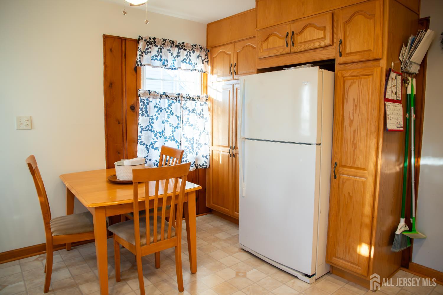13 Eberly Place Fords, NJ 08863 - Photo 5 of 12 a kitchen with stainless steel appliances a refrigerator and a dining table