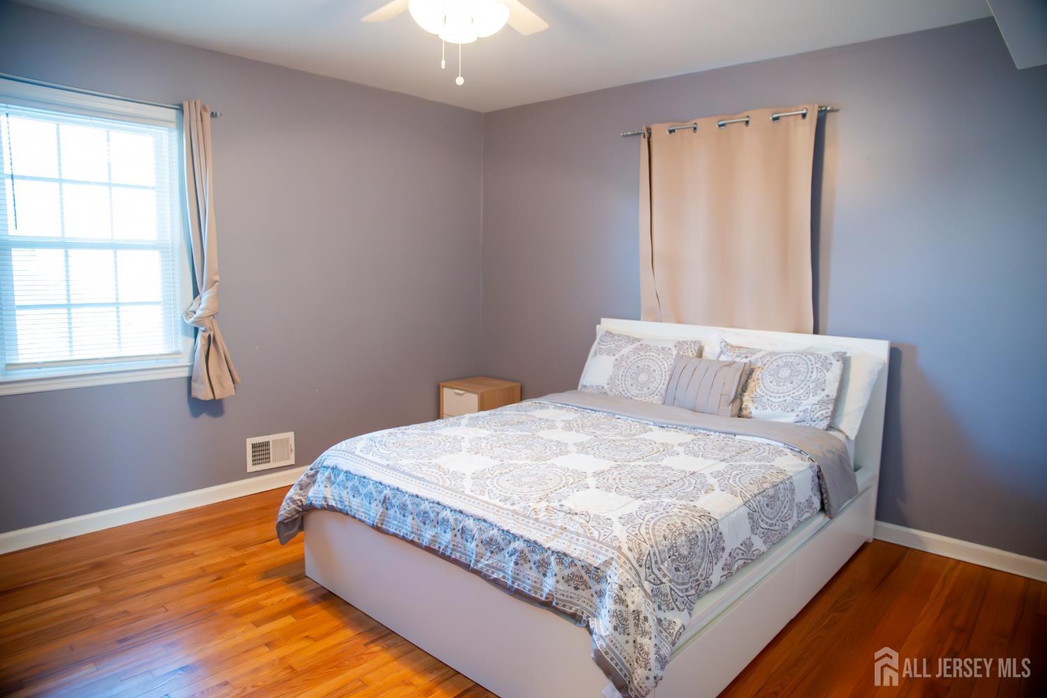 13 Eberly Place Fords, NJ 08863 - Photo 6 of 12 a bed sitting in a bedroom next to a window