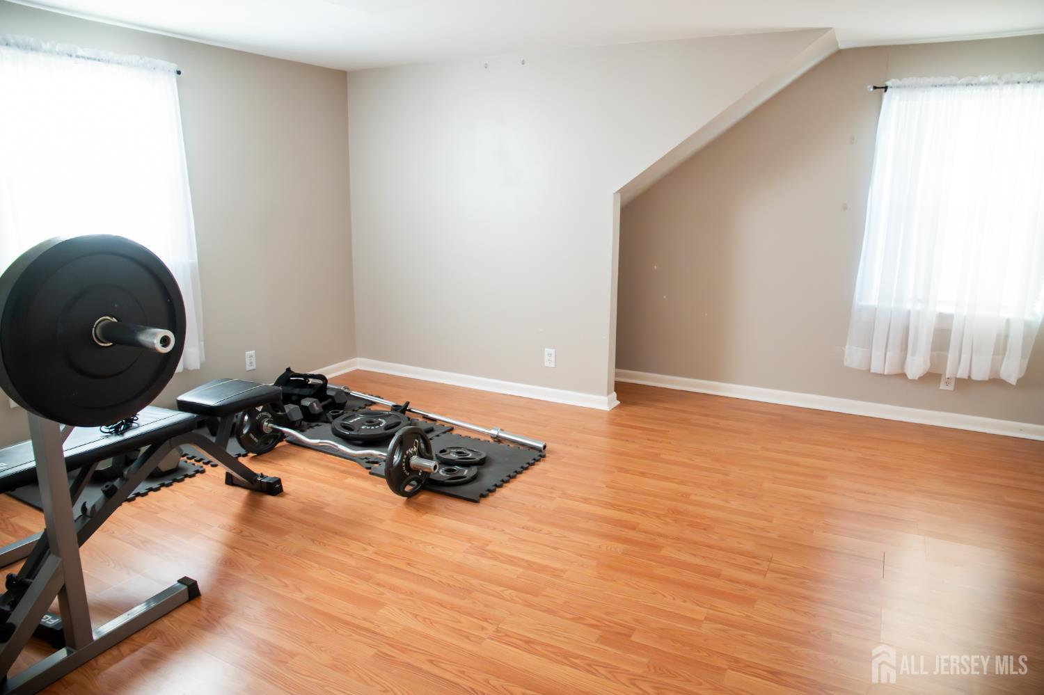 13 Eberly Place Fords, NJ 08863 - Photo 9 of 12 a room with wooden floor and a window