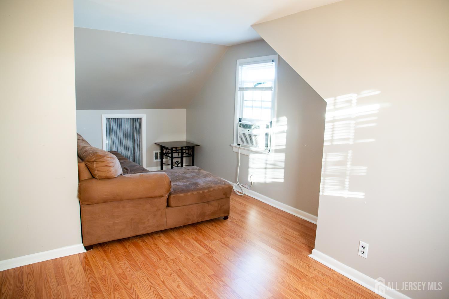13 Eberly Place Fords, NJ 08863 - Photo 10 of 12 a living room with furniture and a window