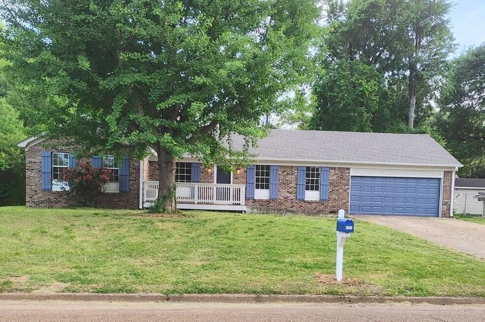 6085 Ivanhoe Road Bartlett, TN 38134 - Photo 1 of 20 front view of a house with a yard