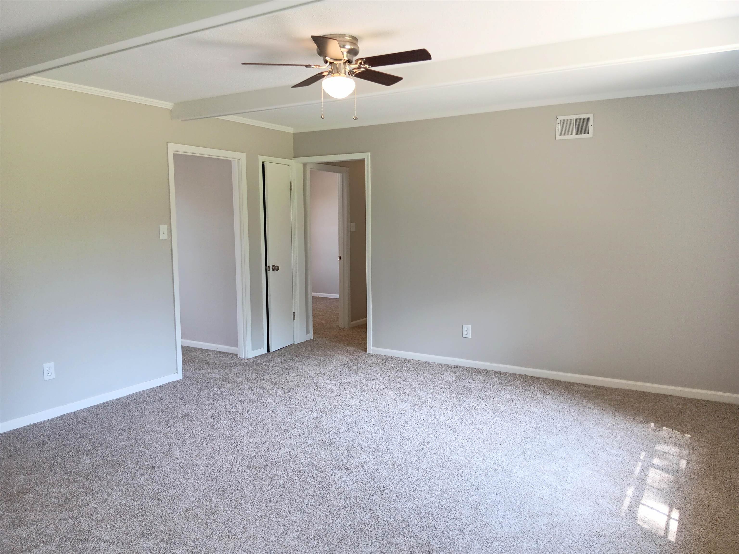 6085 Ivanhoe Road Bartlett, TN 38134 - Photo 5 of 20 an empty room with windows and fan