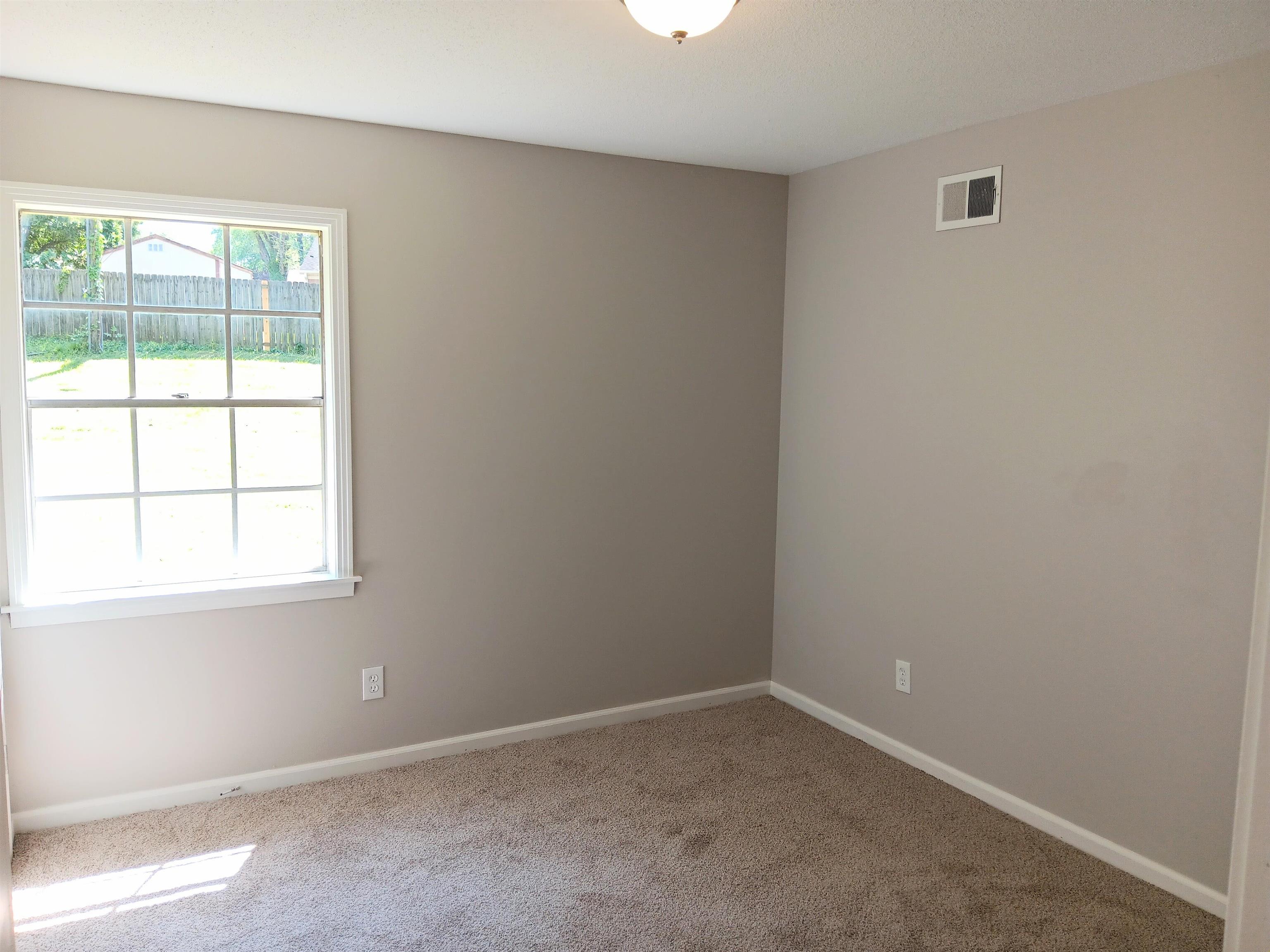 6085 Ivanhoe Road Bartlett, TN 38134 - Photo 8 of 20 an empty room with a window