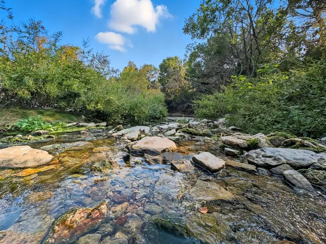 a view of a lake with a big yard