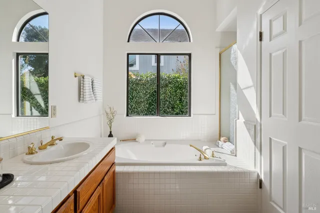 a bedroom with a bed and a table