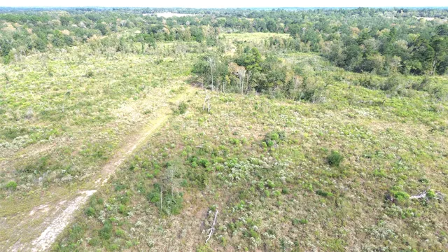 a view of a field with an outdoor space