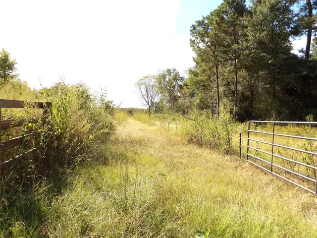 a view of a swimming pool with an outdoor space and seating area
