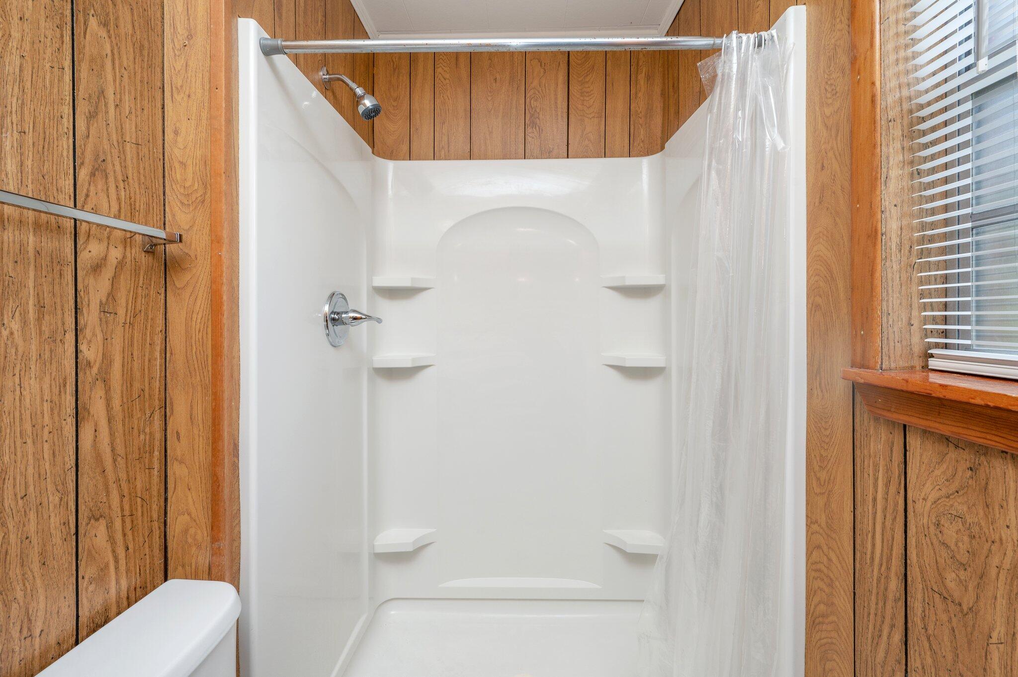 367 Andy Nowling Road DeFuniak Springs, FL 32433 - Photo 20 of 36 a bathroom with a shower and toilet