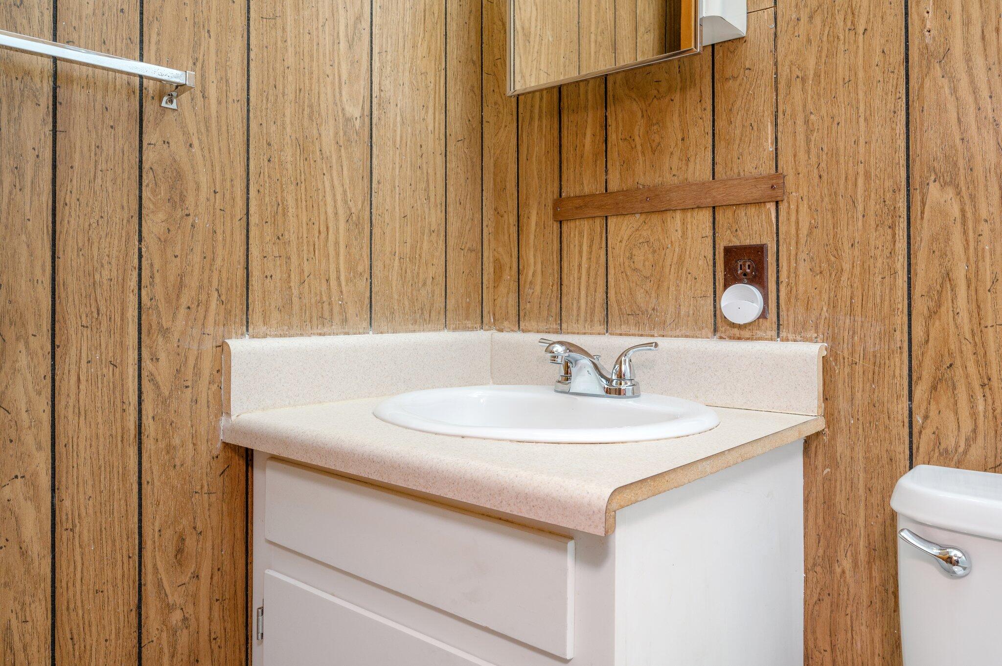 367 Andy Nowling Road DeFuniak Springs, FL 32433 - Photo 26 of 36 a bathroom with a sink and a mirror