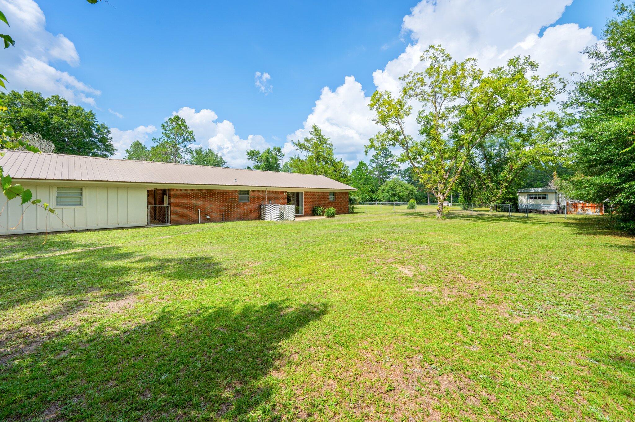 367 Andy Nowling Road DeFuniak Springs, FL 32433 - Photo 30 of 36 a front view of a house with garden