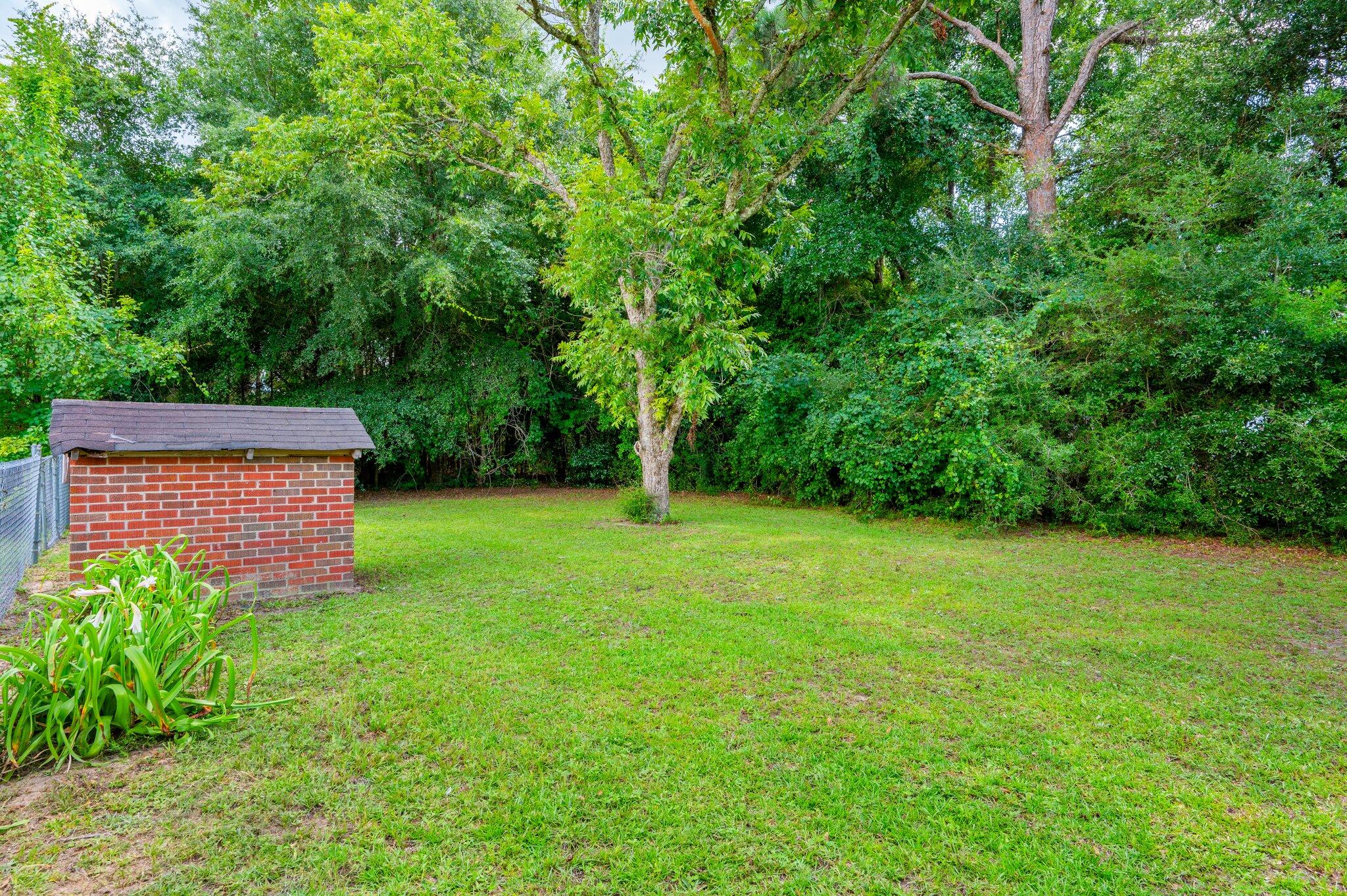 367 Andy Nowling Road DeFuniak Springs, FL 32433 - Photo 34 of 36 a view of a backyard with a garden