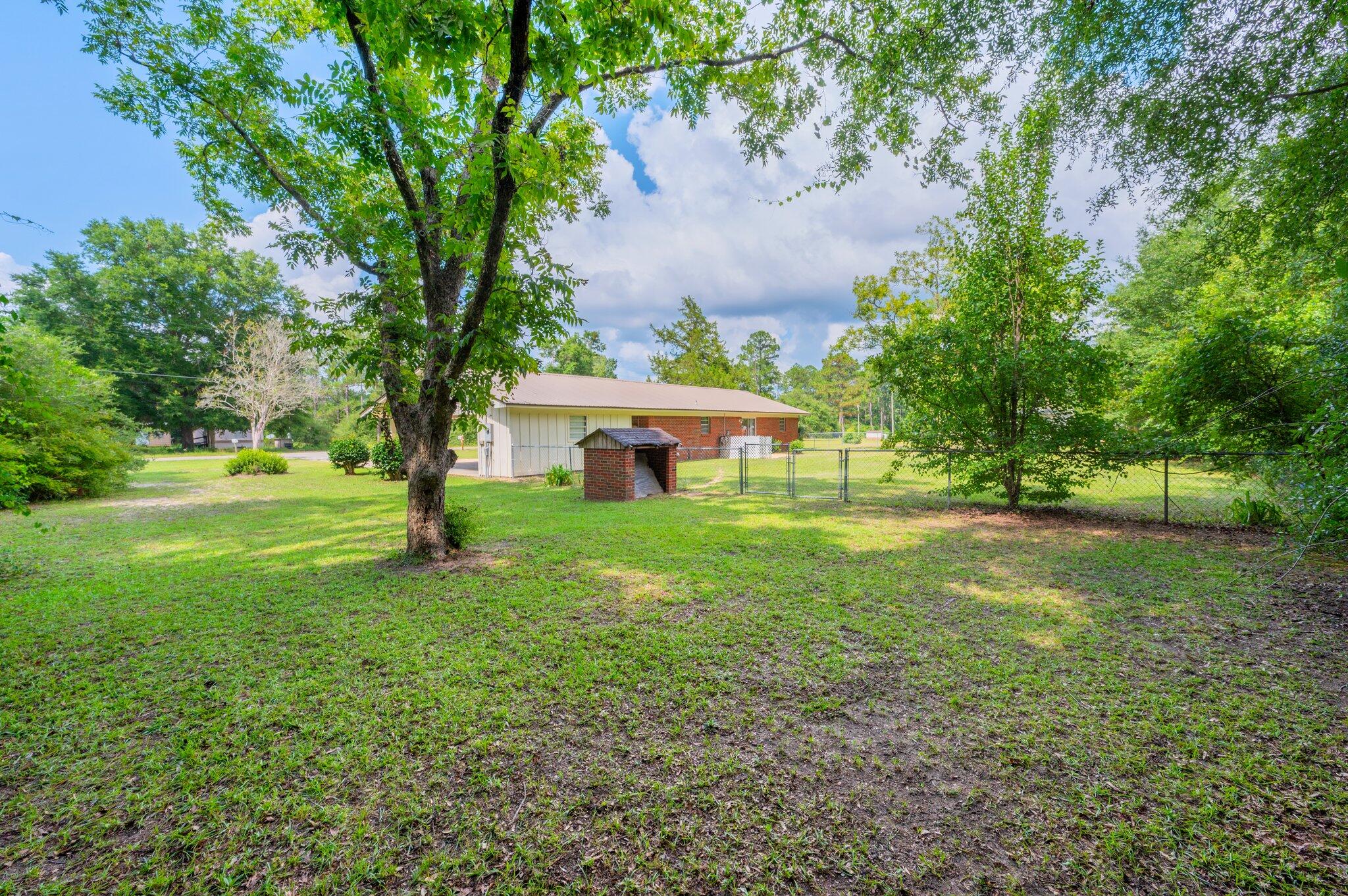367 Andy Nowling Road DeFuniak Springs, FL 32433 - Photo 35 of 36 a view of a house with a yard