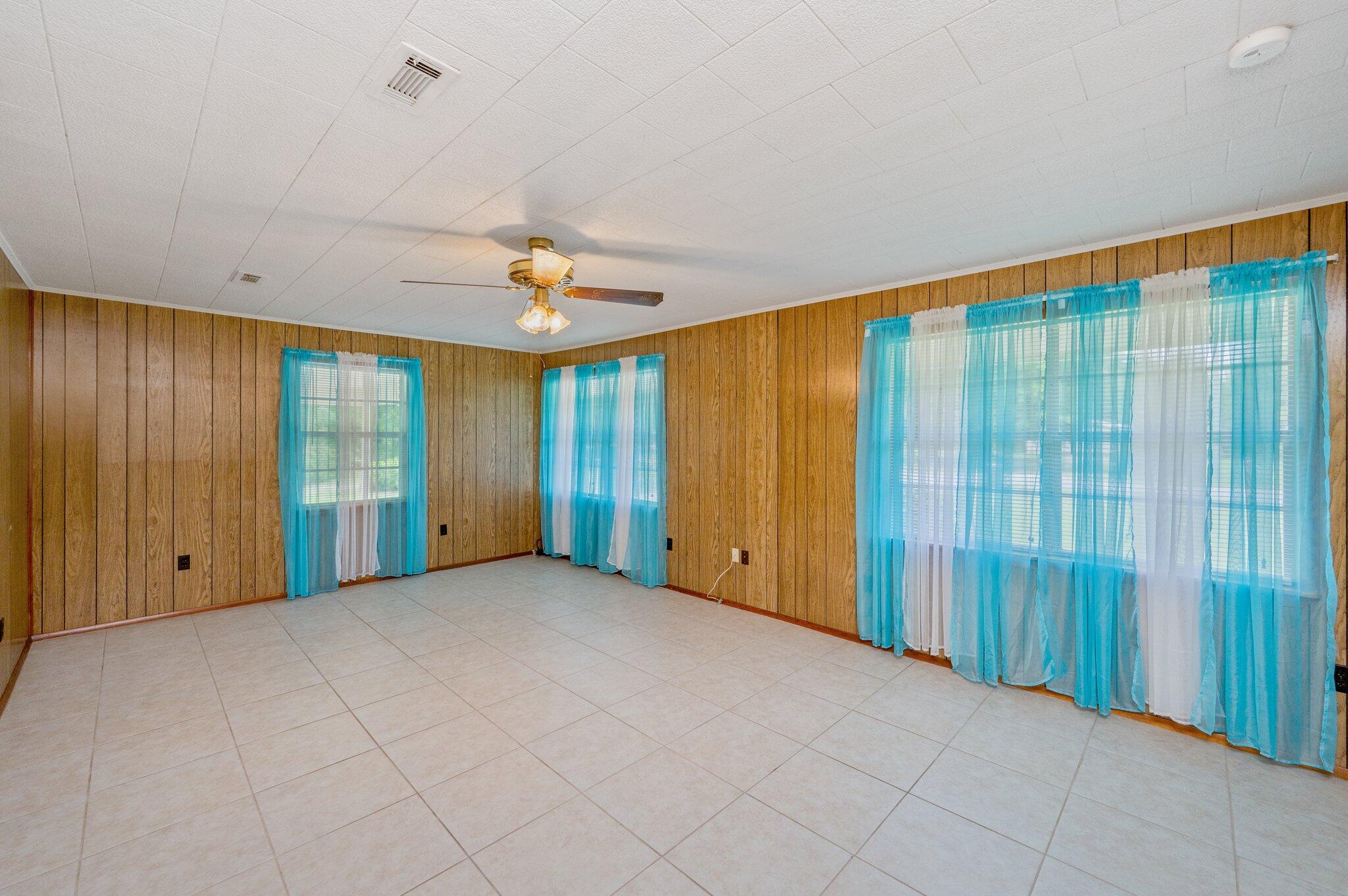 367 Andy Nowling Road DeFuniak Springs, FL 32433 - Photo 6 of 36 a view of an empty room with a window
