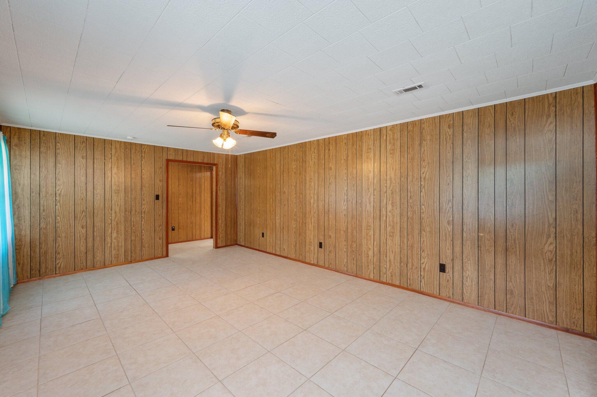 367 Andy Nowling Road DeFuniak Springs, FL 32433 - Photo 8 of 36 wooden floor in an empty room
