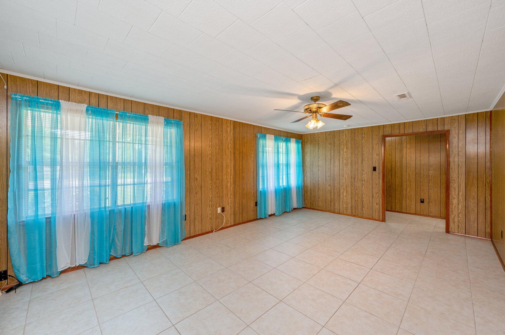 367 Andy Nowling Road DeFuniak Springs, FL 32433 - Photo 9 of 36 a view of an empty room with a window