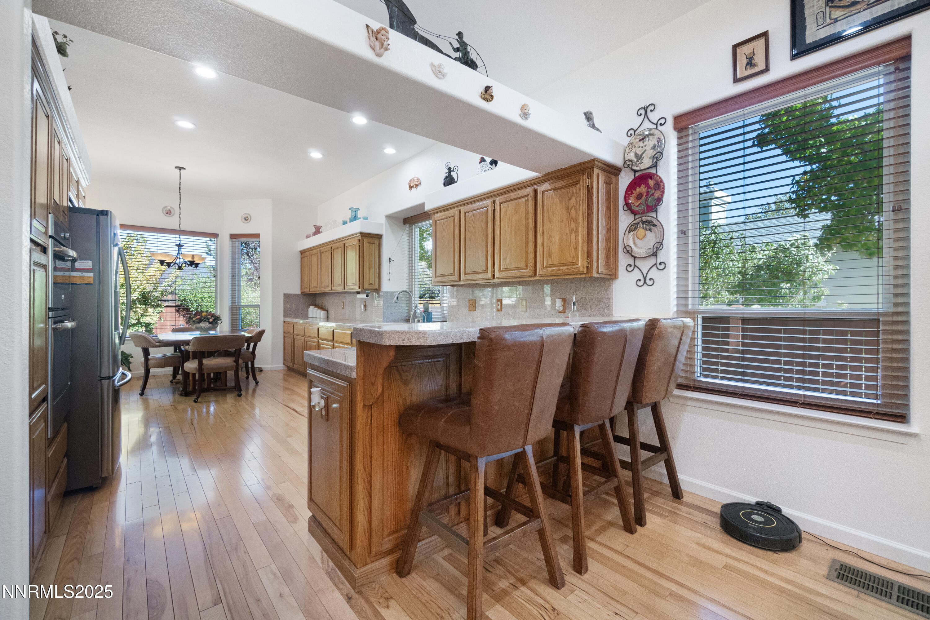 1216 Pleasantview Drive Gardnerville, NV 89460 - Photo 13 of 32 a view of a dining room with furniture and wooden floor
