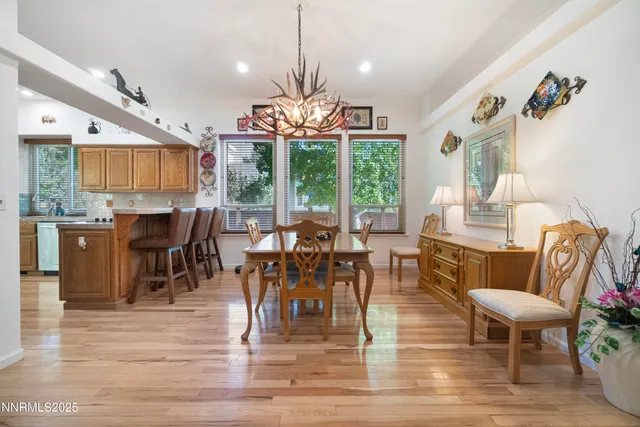 a view of a dining room with furniture window and outside view