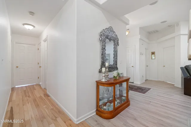 a view of room with furniture and wooden floor