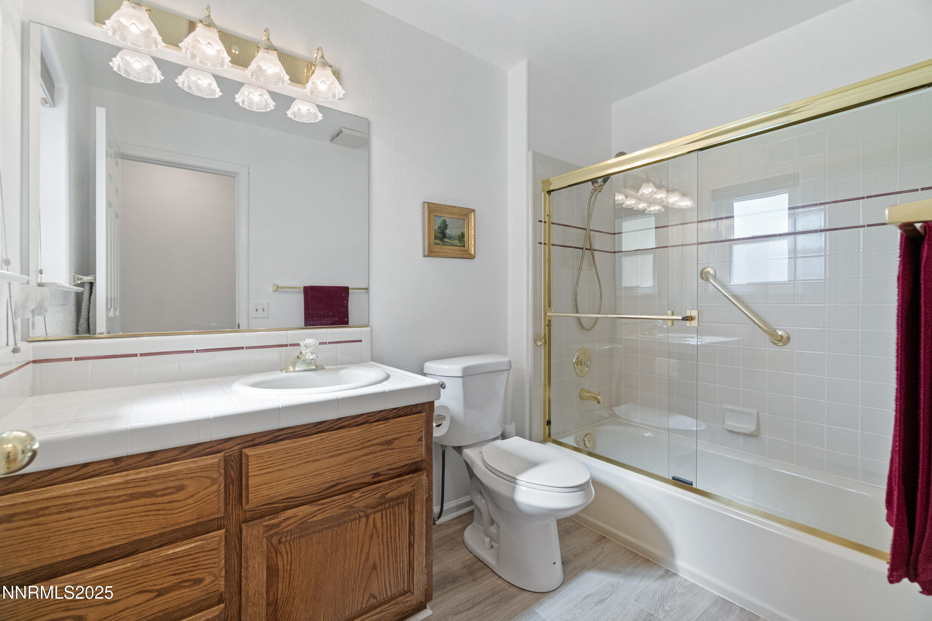 1216 Pleasantview Drive Gardnerville, NV 89460 - Photo 17 of 32 a bathroom with a sink a toilet and shower