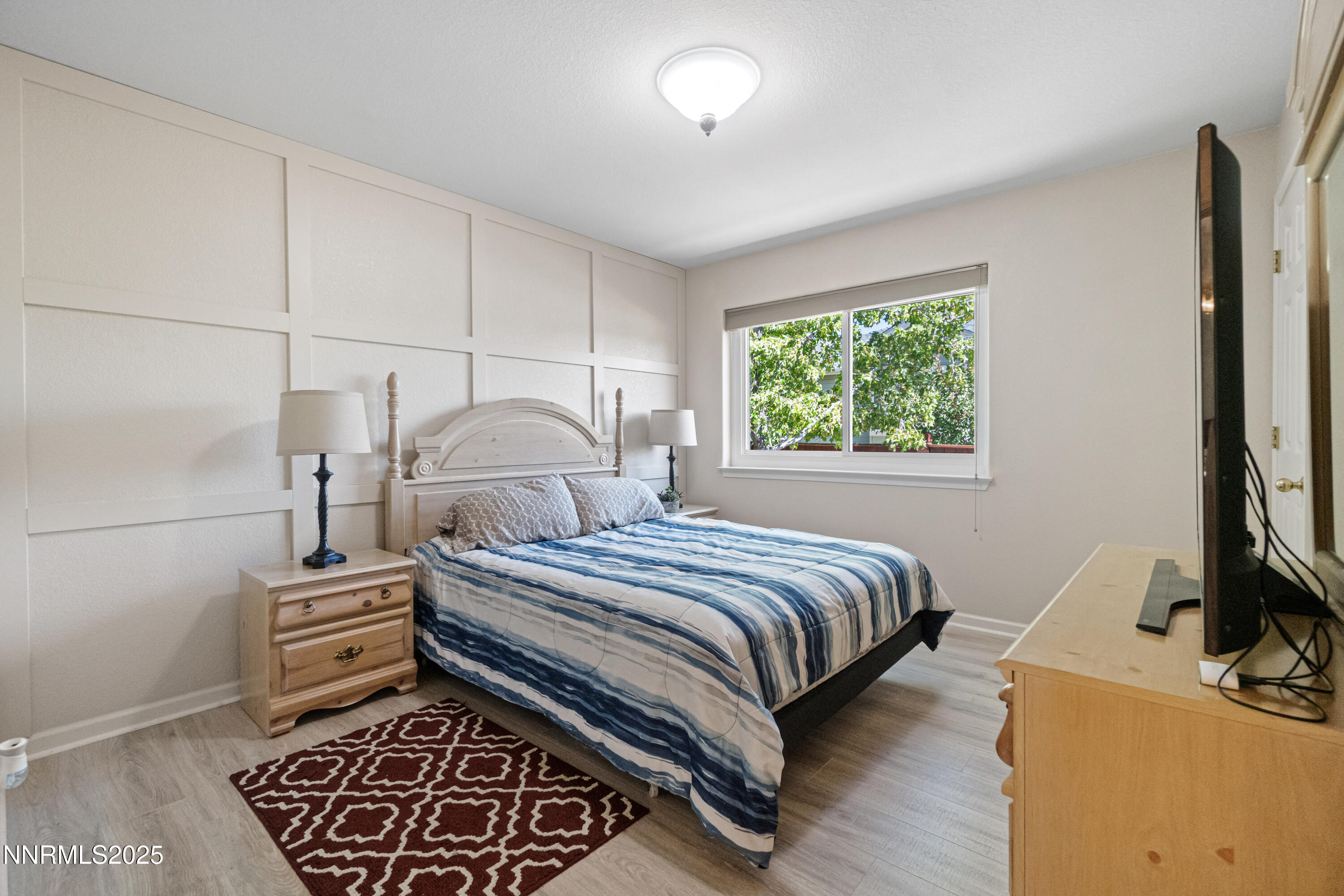 1216 Pleasantview Drive Gardnerville, NV 89460 - Photo 18 of 32 a bedroom with a bed and a tv