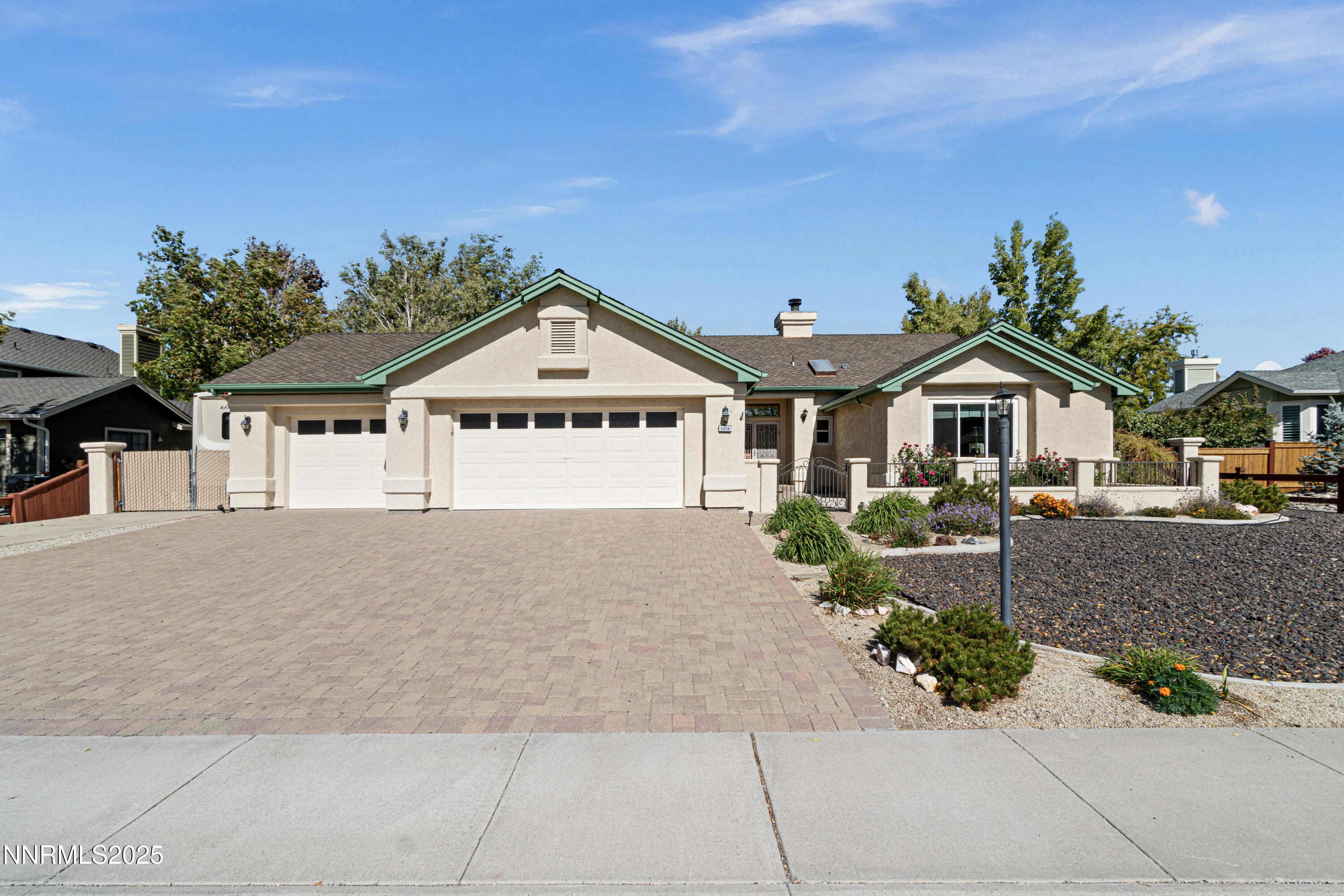 1216 Pleasantview Drive Gardnerville, NV 89460 - Photo 2 of 32 a front view of a house with garden