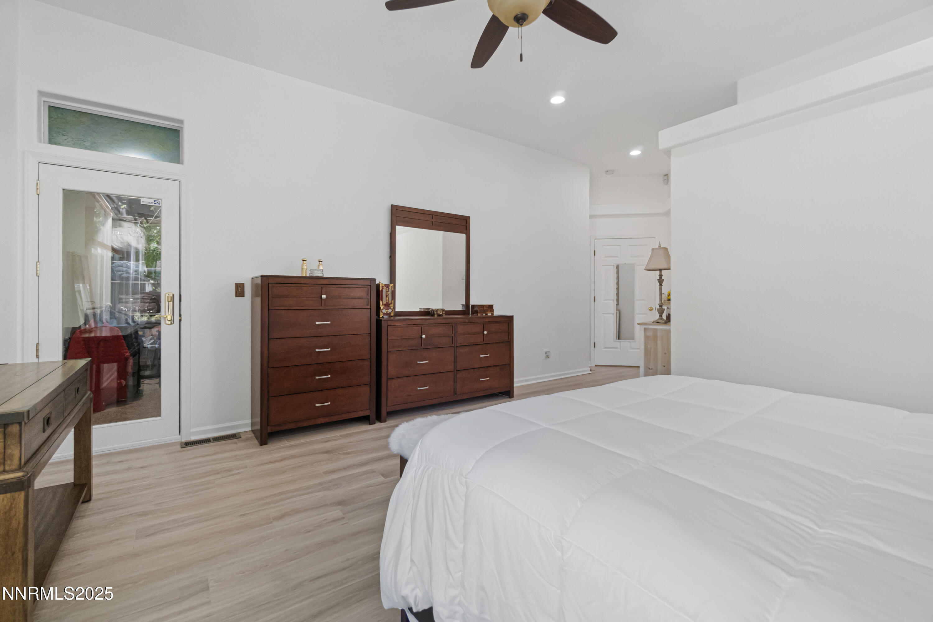 1216 Pleasantview Drive Gardnerville, NV 89460 - Photo 23 of 32 a bedroom with a bed and a chandelier