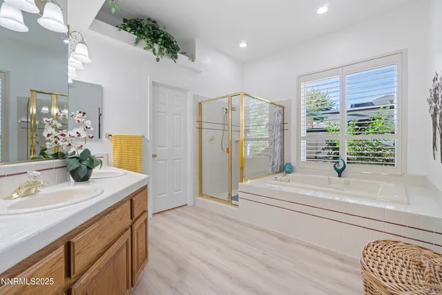 a bathroom with a sink a vanity and a mirror