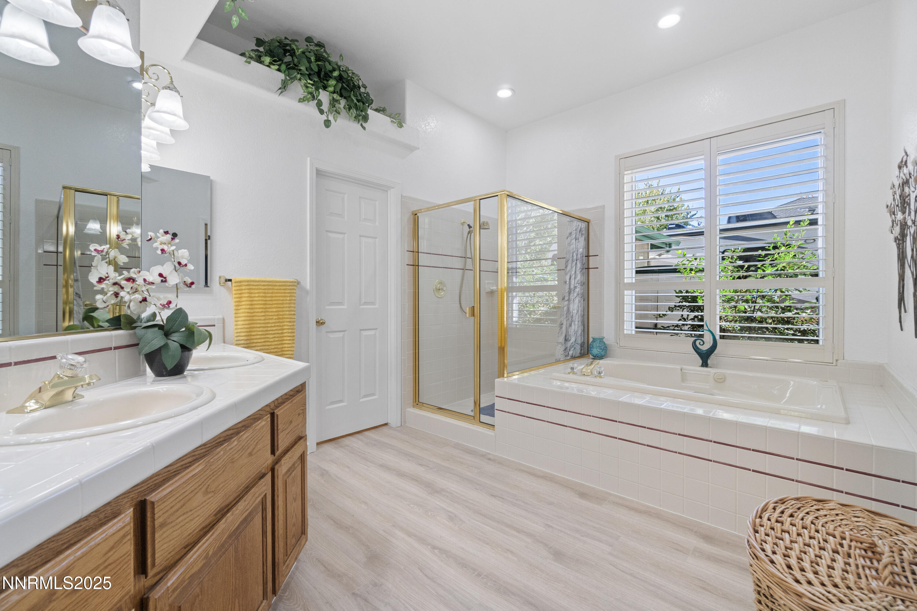 1216 Pleasantview Drive Gardnerville, NV 89460 - Photo 25 of 32 a bathroom with a sink a vanity and a mirror
