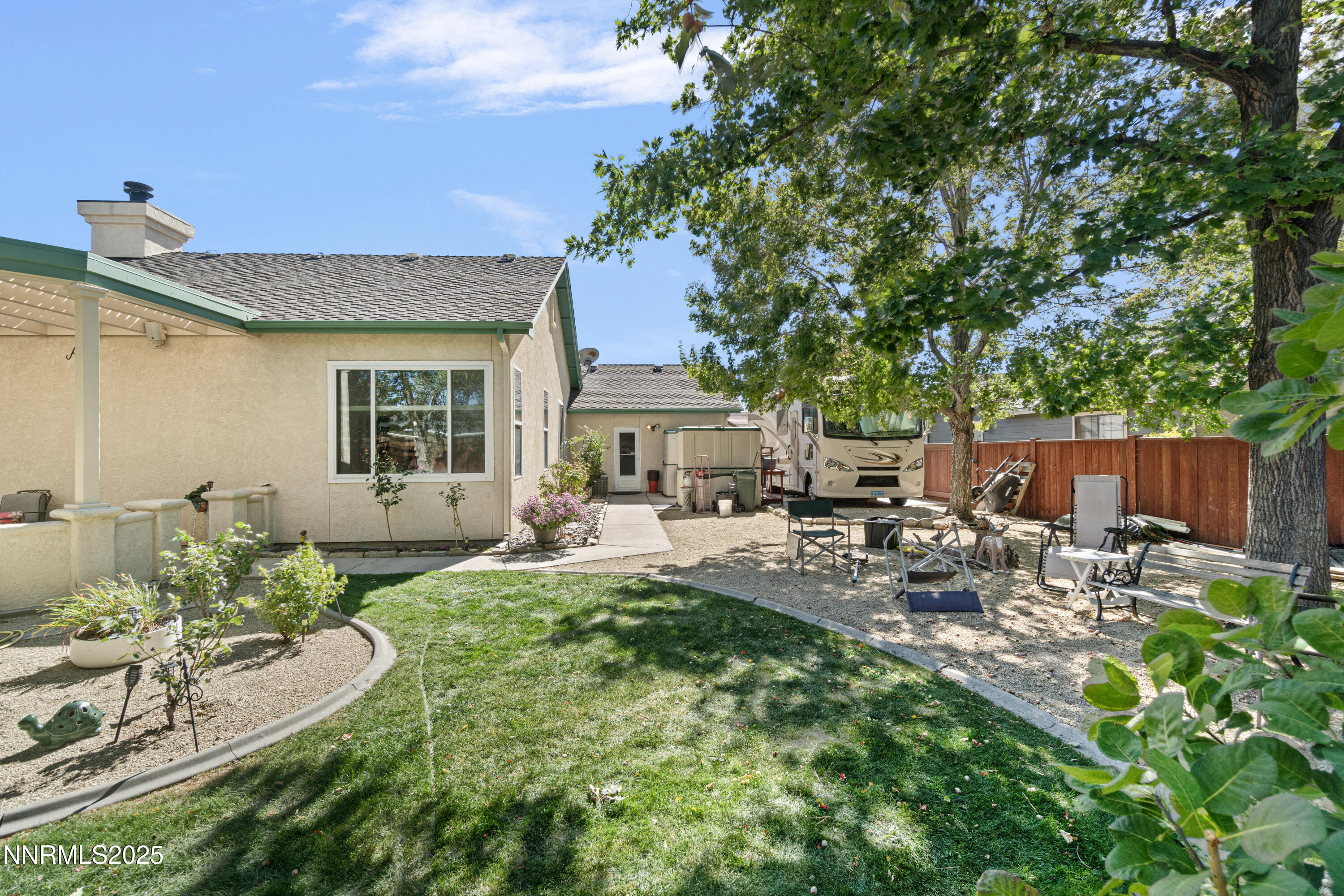 1216 Pleasantview Drive Gardnerville, NV 89460 - Photo 30 of 32 a view of a chair and table in backyard of the house