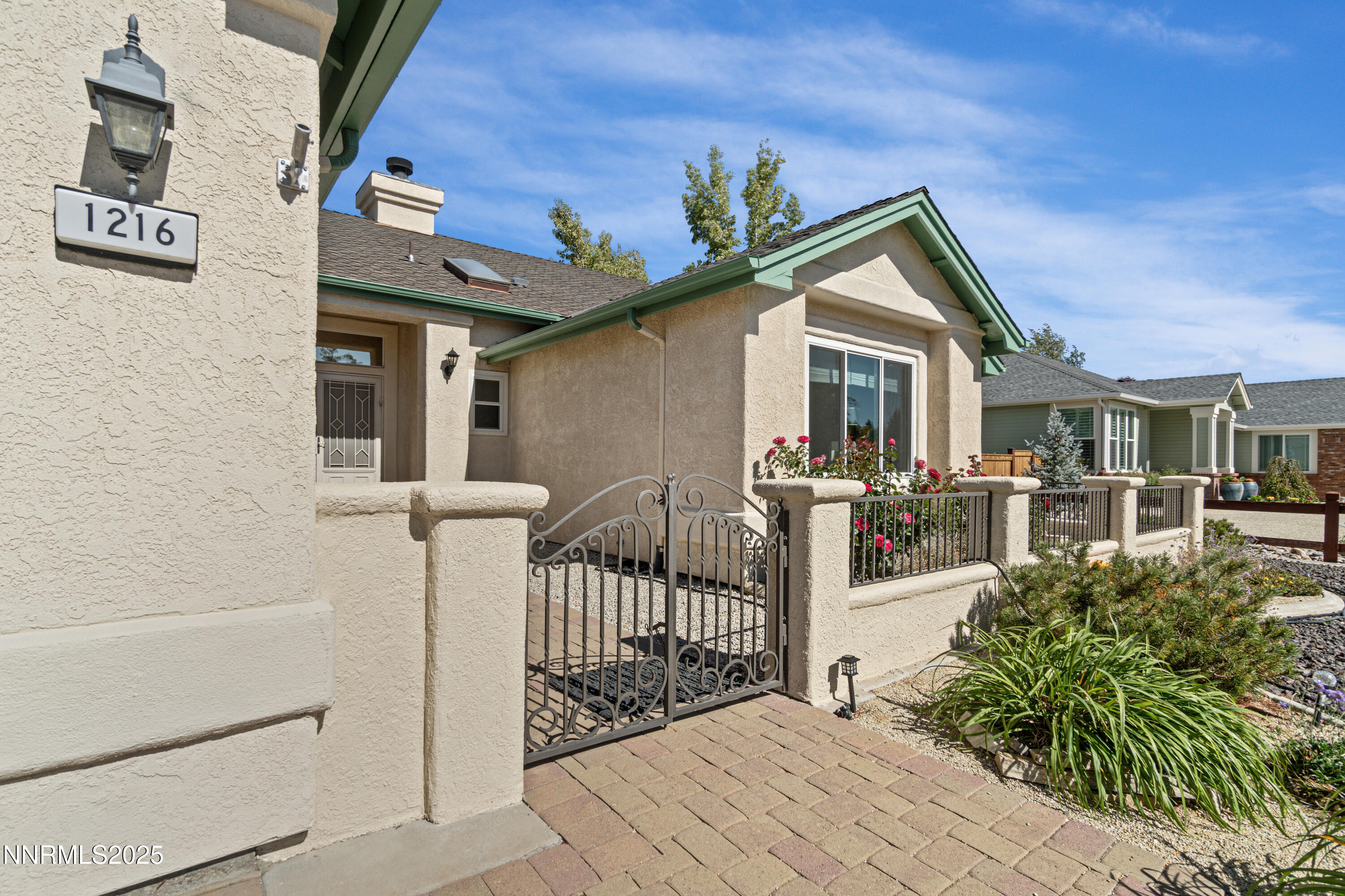 1216 Pleasantview Drive Gardnerville, NV 89460 - Photo 3 of 32 a view of a house with a small yard and potted plants