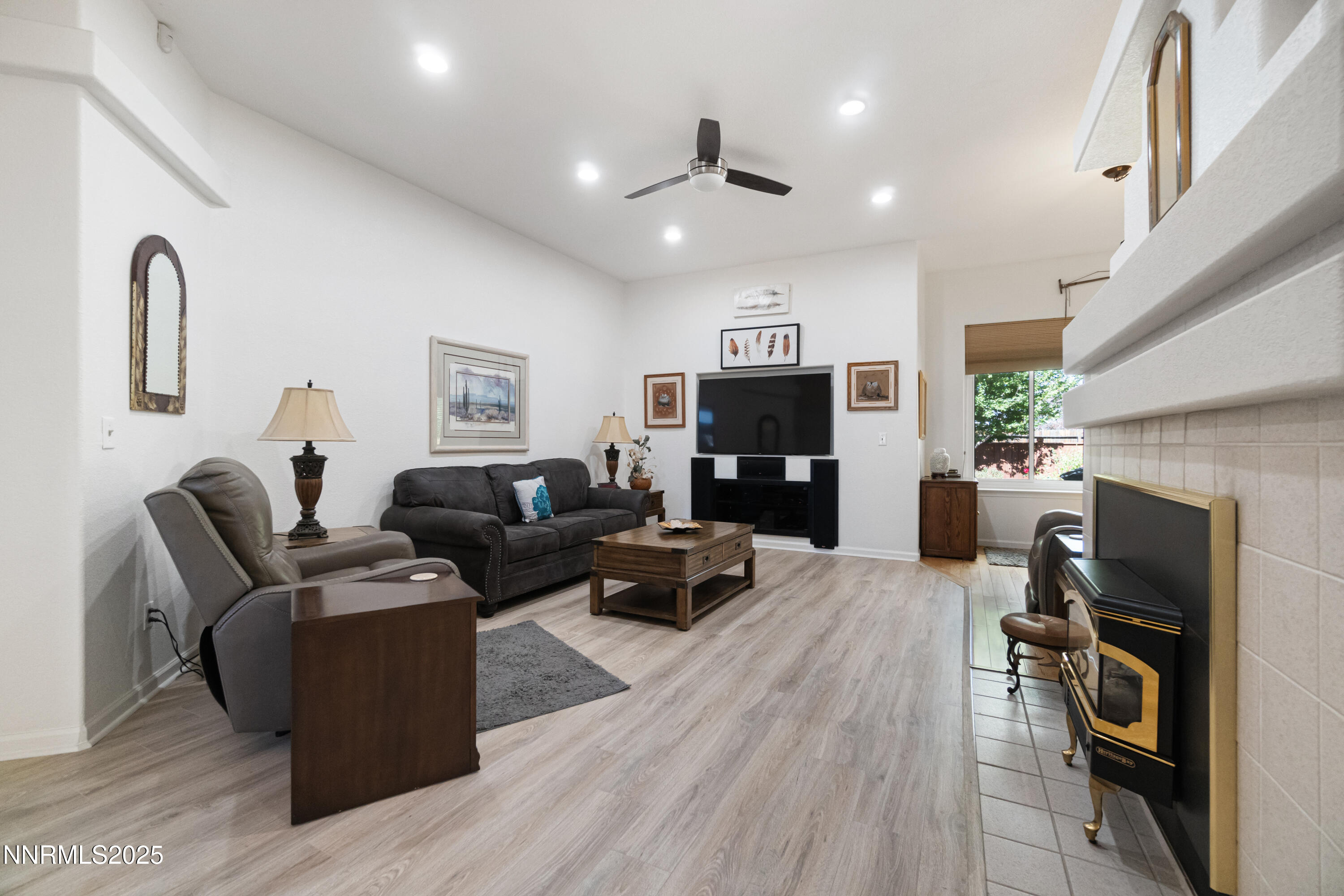 1216 Pleasantview Drive Gardnerville, NV 89460 - Photo 7 of 32 a living room with furniture and a fireplace