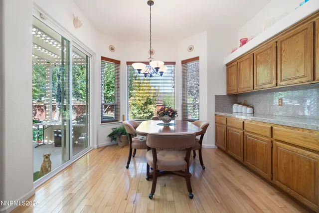a view of a dining room with furniture window and outside view