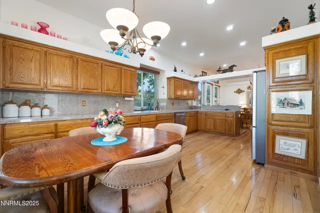 a kitchen with a table and chairs in it