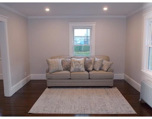 10 Fulton Street Woburn, MA 01801 - Photo 11 of 34 a living room with furniture and a rug