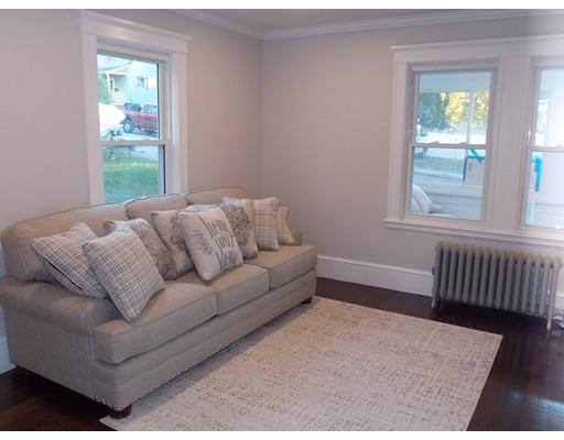 10 Fulton Street Woburn, MA 01801 - Photo 13 of 34 a living room with furniture and a window