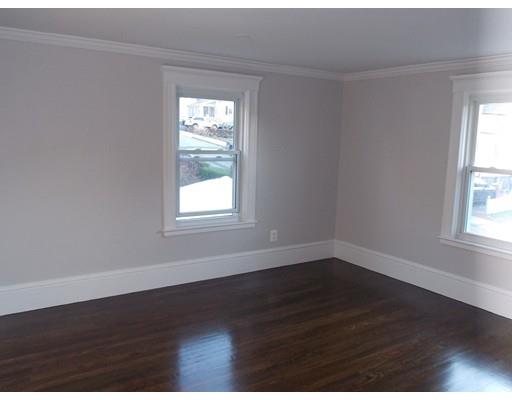 10 Fulton Street Woburn, MA 01801 - Photo 16 of 34 an empty room with wooden floor and windows