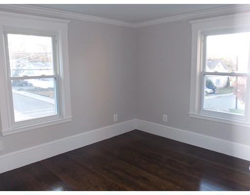 10 Fulton Street Woburn, MA 01801 - Photo 19 of 34 a view of an empty room with wooden floor and a window