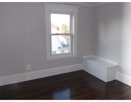 10 Fulton Street Woburn, MA 01801 - Photo 21 of 34 an empty room with wooden floor and windows