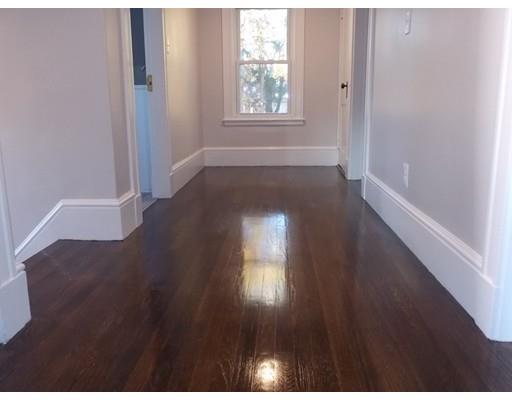 10 Fulton Street Woburn, MA 01801 - Photo 22 of 34 a view of an empty room and wooden floor