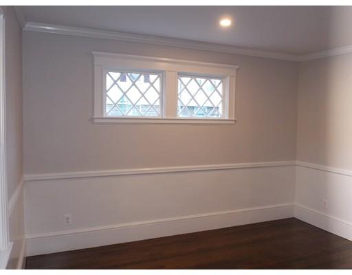 10 Fulton Street Woburn, MA 01801 - Photo 8 of 34 a view of a small space with wooden floor and a window
