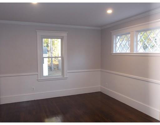 10 Fulton Street Woburn, MA 01801 - Photo 10 of 34 an empty room with wooden floor and windows