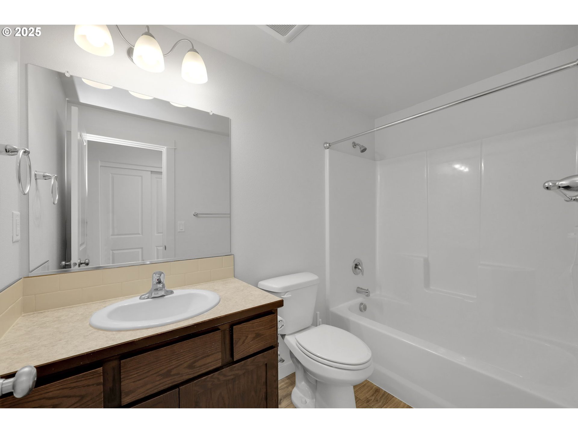 463 35th Street Springfield, OR 97478 - Photo 19 of 41 a bathroom with a sink a toilet a mirror and shower