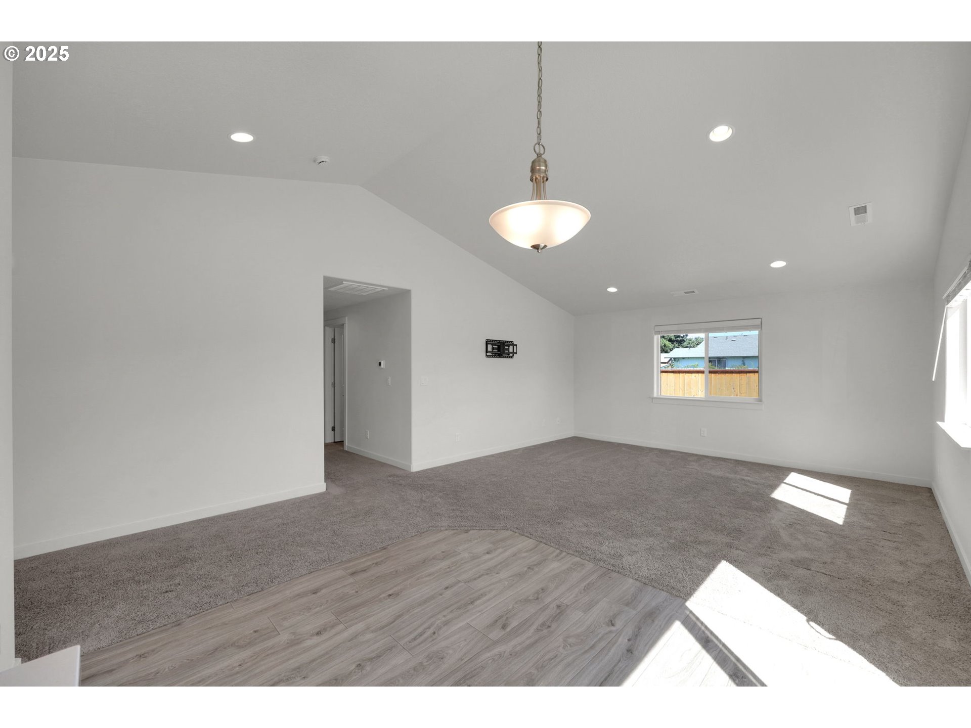 463 35th Street Springfield, OR 97478 - Photo 7 of 41 a view of an empty room with wooden floor