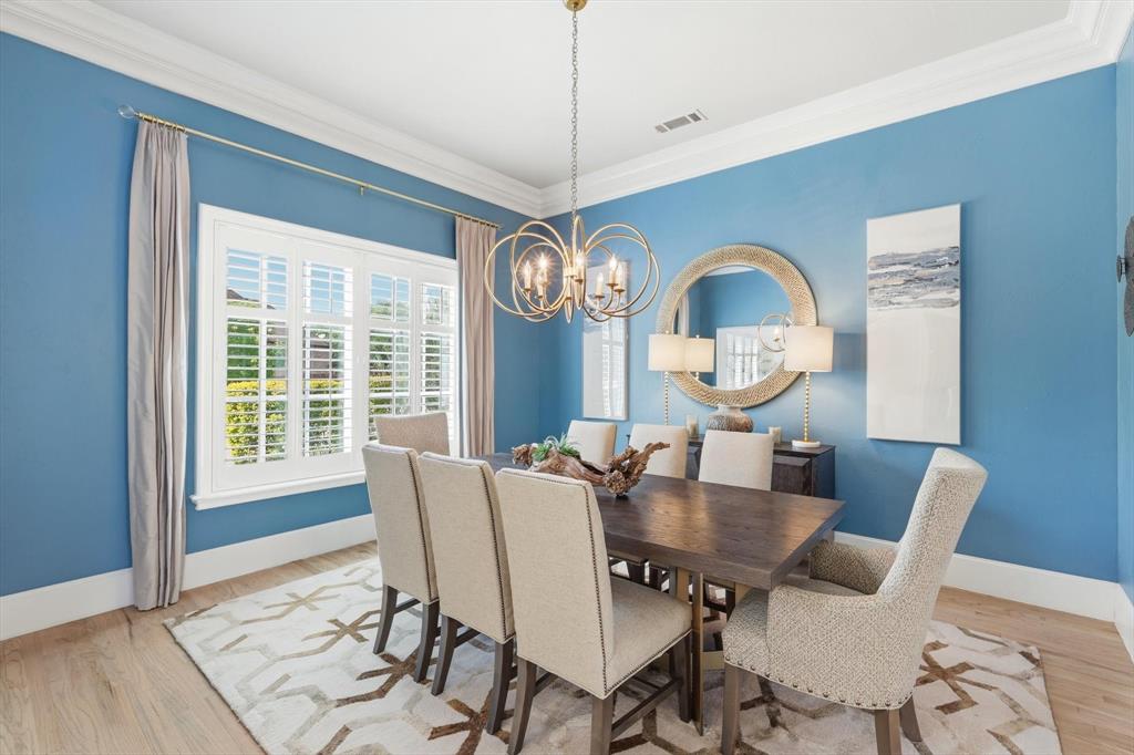 476 Hidden Valley Lane Coppell, TX 75019 - Photo 4 of 40 a view of a dining room with furniture window and wooden floor