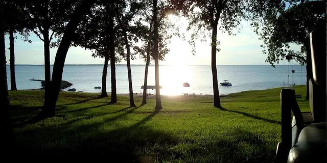 a view of a roof deck with couches and wooden floor