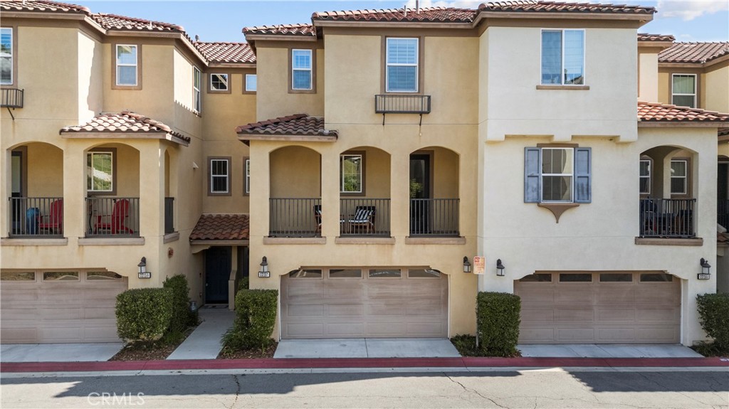 22157 Barrington Way Saugus, CA 91350 - Photo 1 of 46 a front view of a multi story residential apartment building