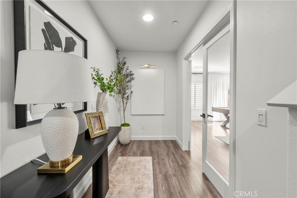 22157 Barrington Way Saugus, CA 91350 - Photo 2 of 46 a view of a workspace with furniture and wooden floor