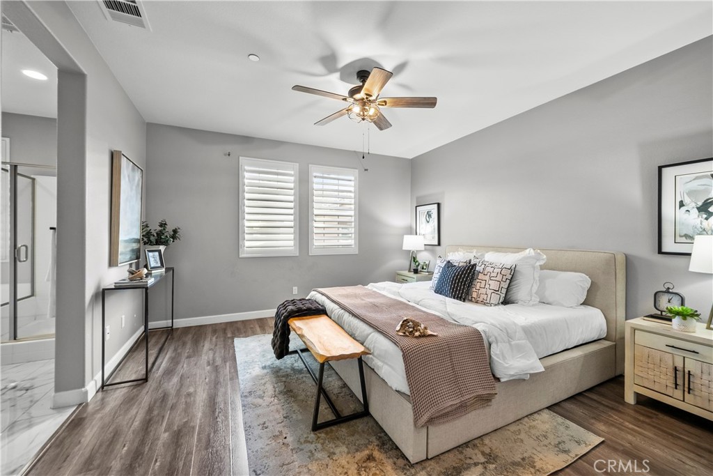 22157 Barrington Way Saugus, CA 91350 - Photo 24 of 46 a bedroom with a bed and a chandelier